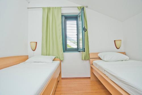 Säng eller sängar i ett rum på Villa Iva