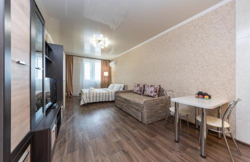 a living room with a couch and a table at Теремки in Kyiv