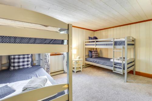 a bunk bed room with two bunk beds at Swim Dock and Game Room Lakefront Poconos Cabin! in Long Pond