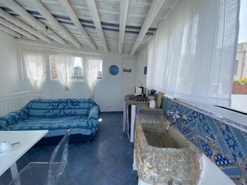 a room with a bed and a tub in it at Cielomare Residence Diffuso in Trapani