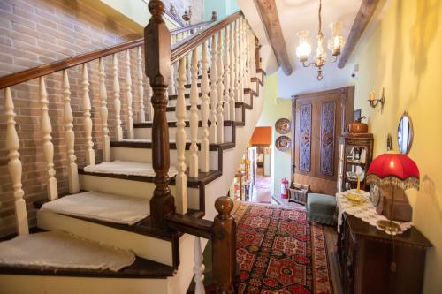 a hallway with a staircase in a house at Bujtina Sidheri in Korçë