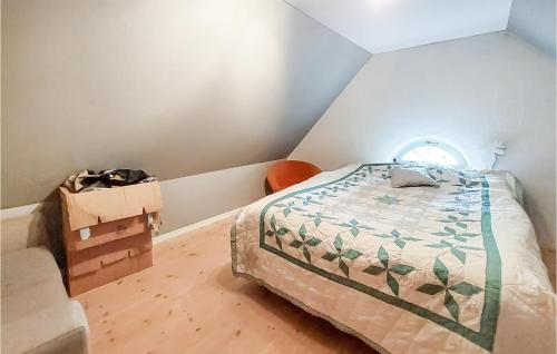 a bedroom with a bed and a dresser and a box at Awesome Home In Genarp With Wifi in Genarp