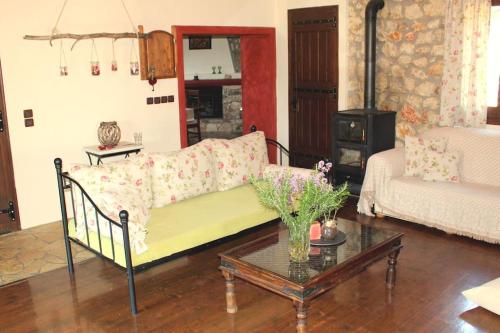 a living room with a couch and a table at Fragosiko - Rustic Retreat in Kefalonia in Argostoli