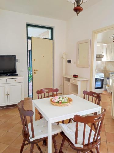 a kitchen with a white table with a pizza on it at La Cèsa in Itri