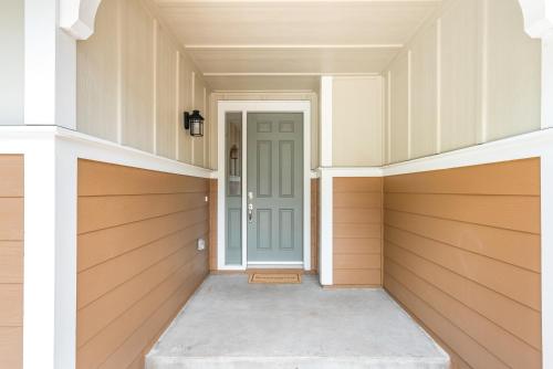 an empty hallway with a door in a house at #ML - Aloha Hoʻonani 3BR Home - MT & Ocean Views! in Waianae
