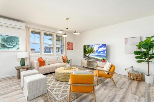 a living room with a couch and chairs at #ML - Aloha Hoʻonani 3BR Home - MT & Ocean Views! in Waianae