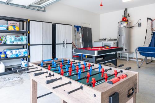 a ping pong table in a room with a ping pong ball at #ML - Aloha Hoʻonani 3BR Home - MT & Ocean Views! in Waianae