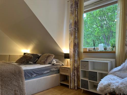 מיטה או מיטות בחדר ב-Comfort Zone Ostroda BOHO SCANDI
