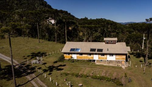 an aerial view of a house on a hill at Hotel e Pousada Montanha Real in Urubici