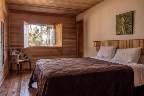 Katil atau katil-katil dalam bilik di Hotel e Pousada Montanha Real