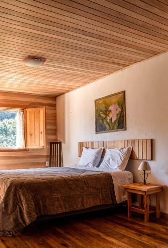 Katil atau katil-katil dalam bilik di Hotel e Pousada Montanha Real