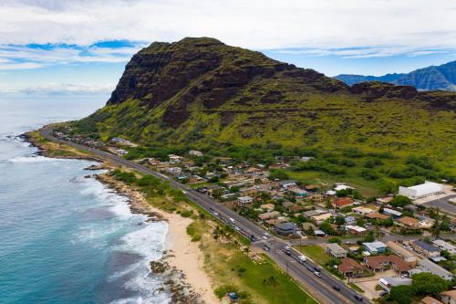 an aerial view of a beach with a mountain at #ML - Aloha Hoʻonani 3BR Home - MT & Ocean Views! in Waianae