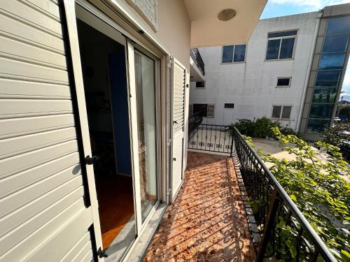 an open door to a balcony in a building at Hotel Kalaja in Shkodër