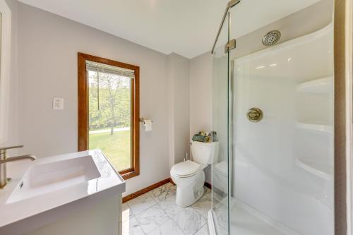 a bathroom with a toilet and a glass shower at Wisconsin Vacation Rental Retreat with Deck in Twin Lakes