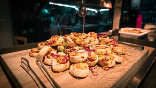 a bunch of food sitting on a wooden cutting board at Penzion Maria in Liptovský Mikuláš