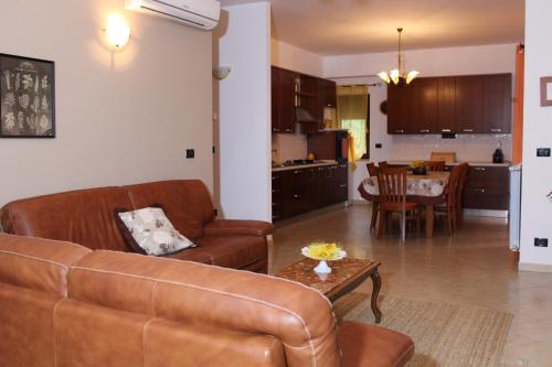 a living room with a couch and a table at Contedoro Living in Ariano Irpino