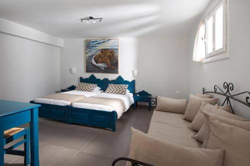Ένα ή περισσότερα κρεβάτια σε δωμάτιο στο Poseidon Hotel