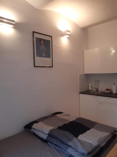 Ένα ή περισσότερα κρεβάτια σε δωμάτιο στο Apartament Klimt 1