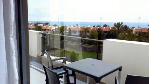 a balcony with a table and chairs on a balcony at La Suite Hotel Agadir Adults Only in Agadir
