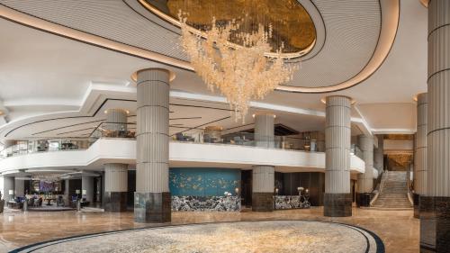 a lobby of a building with a chandelier at InterContinental Bangkok, an IHG Hotel in Bangkok