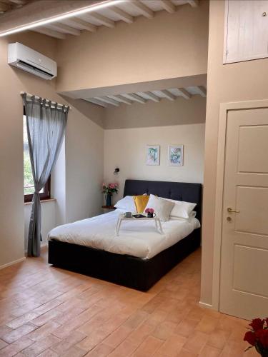 Ένα ή περισσότερα κρεβάτια σε δωμάτιο στο B&B La Fenice