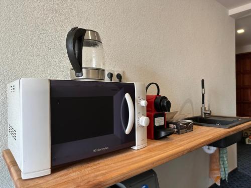 a microwave sitting on top of a counter at Ubytování Smrk in Nové Město pod Smrkem
