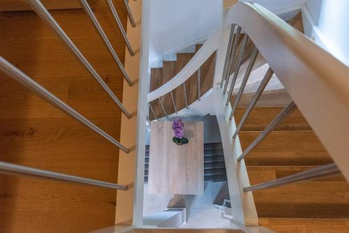 a stairway with a wedding dress hanging on it at Struck Landhotel & SPA in Attendorn