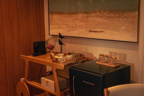 a small table with a tray of drinks on it at Saison Resort & Spa in Itaipava