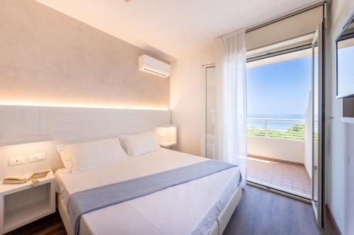 Postel nebo postele na pokoji v ubytování Hotel Corfù