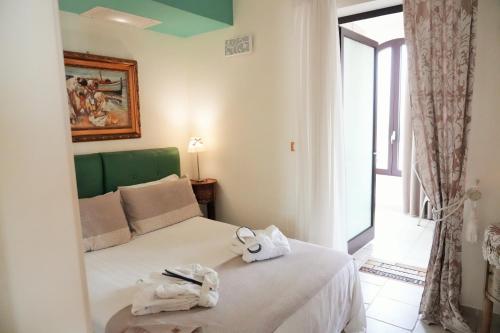Katil atau katil-katil dalam bilik di Bed & Breakfast Al Borgo