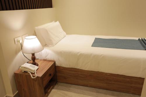 Cama o camas de una habitación en New Pyramid Front Hotel