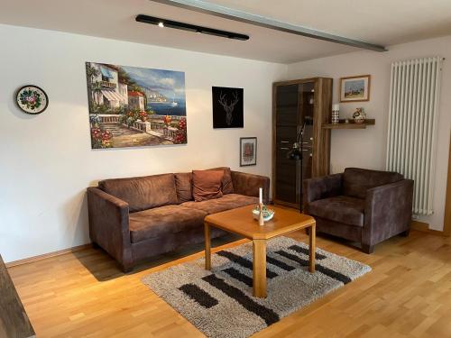 a living room with a couch and a table at Ferienwohnung Meridiana in Tuntenhausen