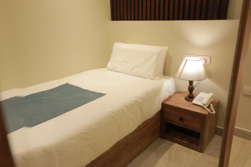 Cama o camas de una habitación en New Pyramid Front Hotel