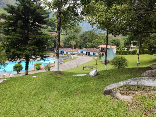 a view of a swimming pool in a park at Hosteria Puerta del Nus in Cisneros
