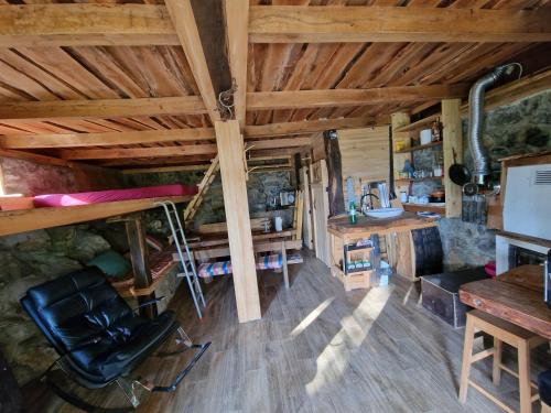 a room with a bunk bed and a desk and chair at Grey green and fun 4 YOU - 2 Cottages in Drganja Sela