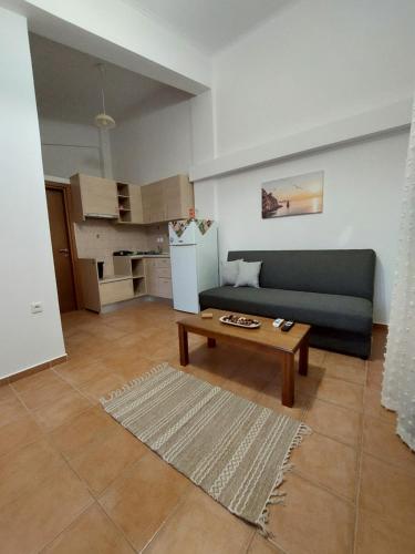 a living room with a couch and a coffee table at El Verde Apartments in Skala