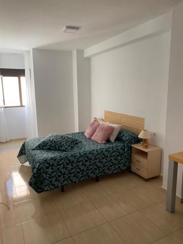Postel nebo postele na pokoji v ubytování Apartamentos Wei