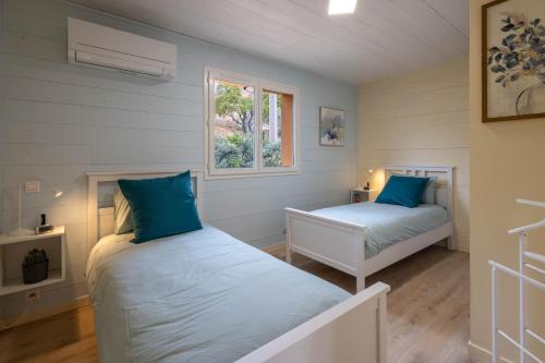 Ένα ή περισσότερα κρεβάτια σε δωμάτιο στο L'Oliveraie