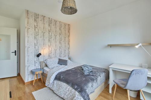 Posteľ alebo postele v izbe v ubytovaní Appartement avec belle vue dégagée du 11e étage