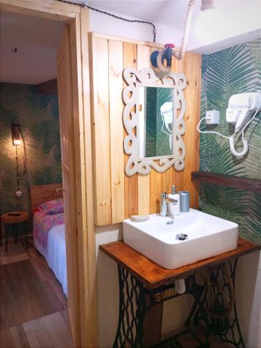 a bathroom with a sink and a mirror at IL Vicoletto in Serra San Bruno