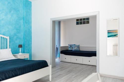 a bedroom with two beds and a mirror at B&B Sapore di Mare in Gaeta