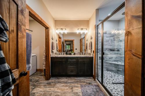 a bathroom with a large sink and a shower at Brand New Build Luxury Mountain Chalet with Hot tub, pool, Game Room, Premium features in Ellijay