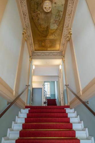 a stairway with a painting on the ceiling at The Good Place in Kreuzberg Berlin in Berlin