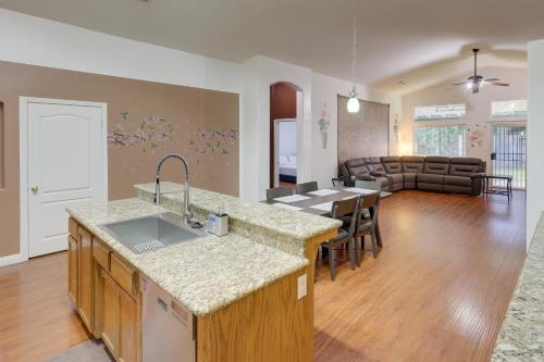 a living room with a kitchen and a dining room at Pet-Friendly California Retreat with Fenced-In Yard! in Bakersfield