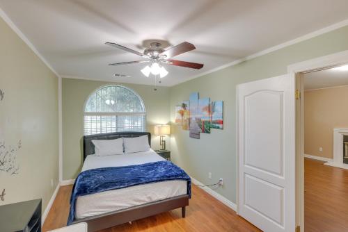 a bedroom with a bed and a ceiling fan at Pet-Friendly California Retreat with Fenced-In Yard! in Bakersfield