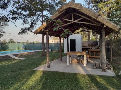 a gazebo with a picnic table in a yard at CAMPING DON EMILIO in Lobos