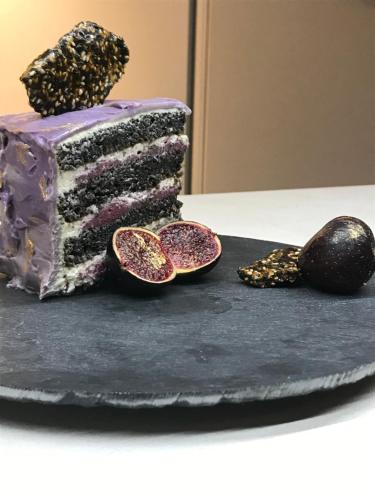 a cake sitting on top of a table with sprinkles at Maison écologique de qualité supérieure in Monflanquin