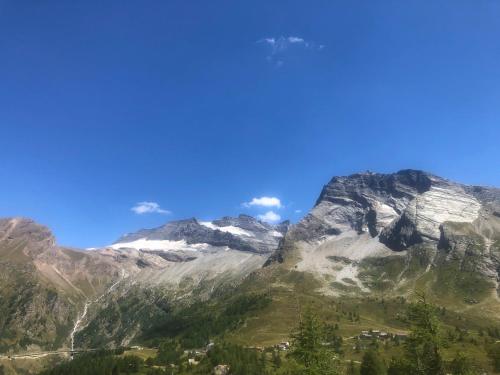 a view of a mountain range with a blue sky at Giuditta FreeCarPark&Garden in Domodossola