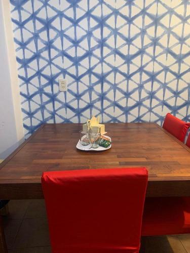 a wooden table with a plate of food on it at Cassanova III in San Luis