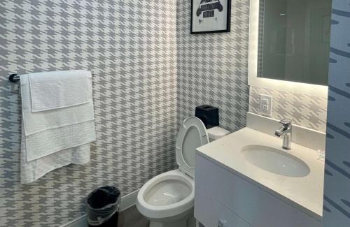 a bathroom with a toilet and a sink at Superior Shores Hotel, BW Signature Collection by Best Western in Thunder Bay